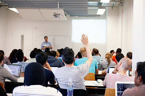 Student putting his hand up